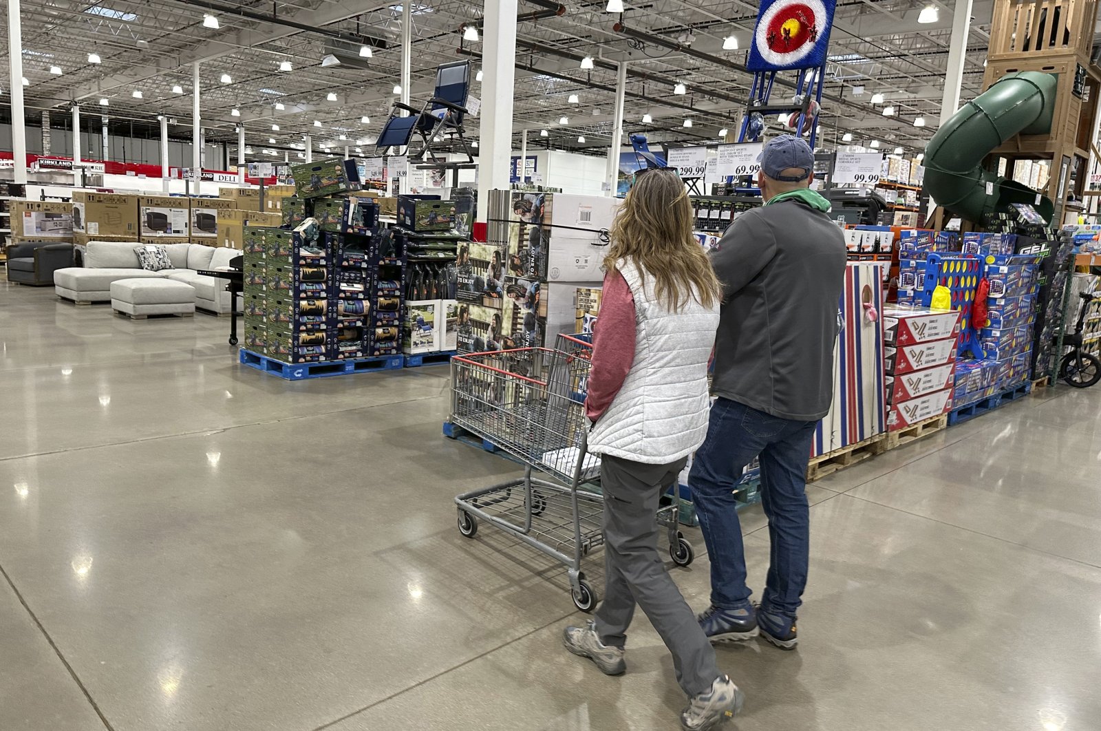 Shoppers pass displays of goods in a Costco warehouse, in Sheridan, Colorado, U.S, Feb. 25, 2024. (AP Photo) 