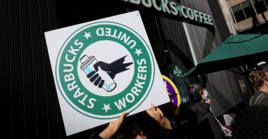 Members of the Starbucks Workers Union and other labor organization picket and hold a rally outside a company owned Starbucks store, during the coffee chain's Red Cup Day event in New York City, U.S., Nov. 16, 2023. (Reuters Photo)