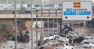Damaged cars are seen along a road affected by torrential rains that caused flooding, on the outskirts of Valencia, Spain, Oct. 31, 2024. (Reuters Photo)
