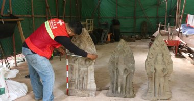 This handout photo provided by Apsaras National Authority shows a centuries-old sandstone statue being measured at Angkor Thom, Cambodia, Oct. 24, 2024. (AP Photo)