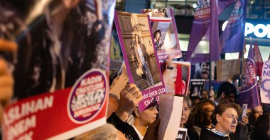 Protesters carry photos of murdered women during a rally against the increasing number of femicides in the country, Izmir, Türkiye, Oct. 16, 2024. (Reuters Photo)