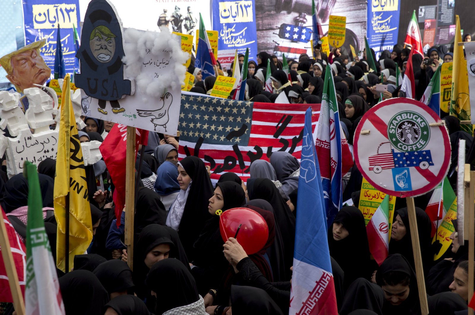 On the eve of renewed sanctions by Washington, Iranian protesters demonstrate outside the former U.S. Embassy, Tehran, Iran, Nov. 4, 2018. (Getty Images Photo)