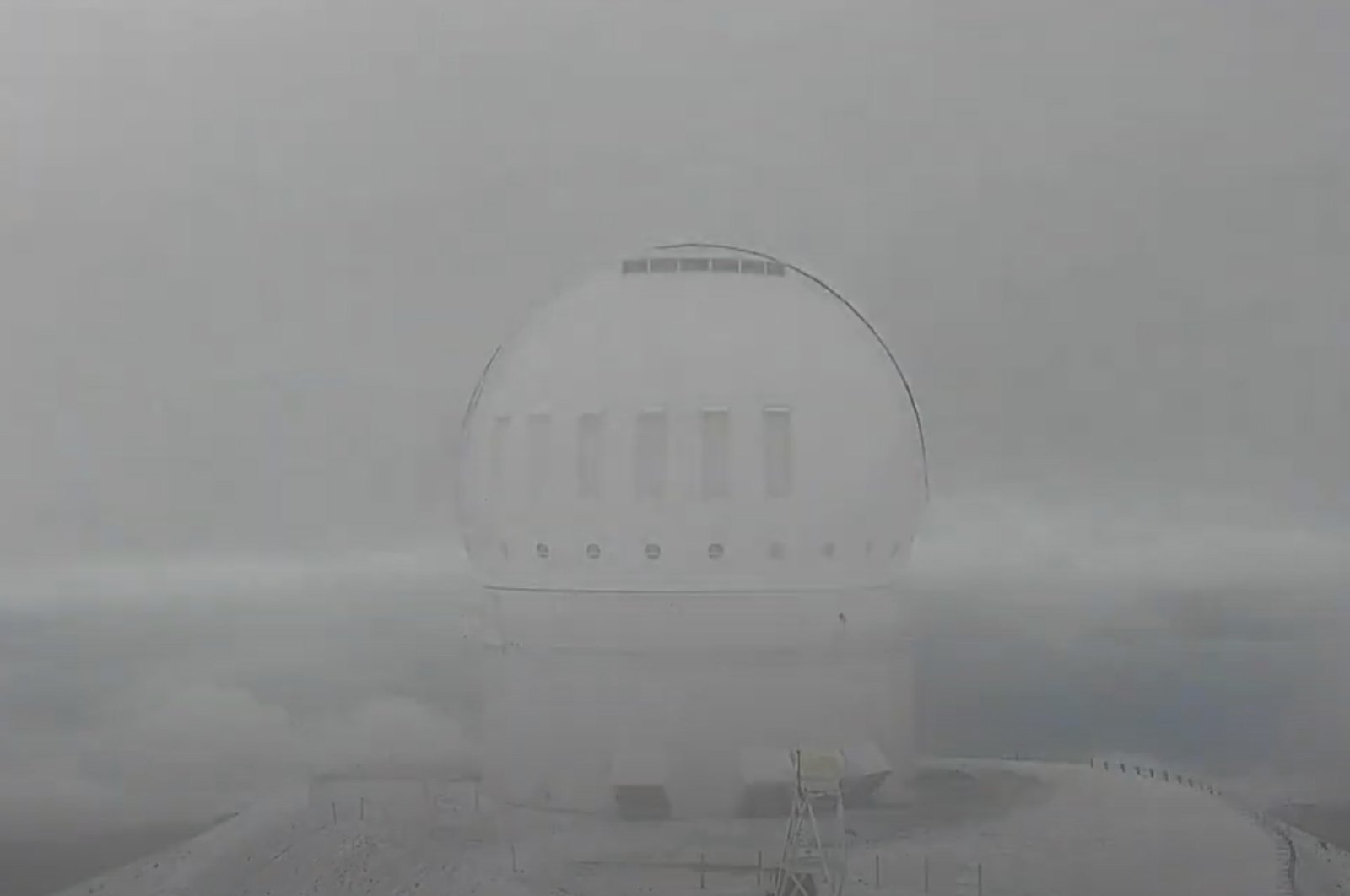 This image from the video provided by the Canada-France-Hawai’i Telescope shows snow on the summit of Mauna Kea, Hawaii, U.S., Oct. 27, 2024. (AP Photo)