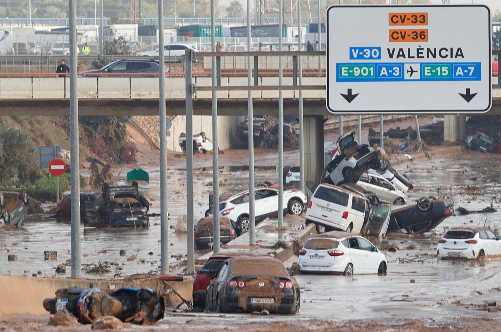 Damaged cars are seen along a road affected by torrential rains that caused flooding, on the outskirts of Valencia, Spain, Oct. 31, 2024. (Reuters Photo)