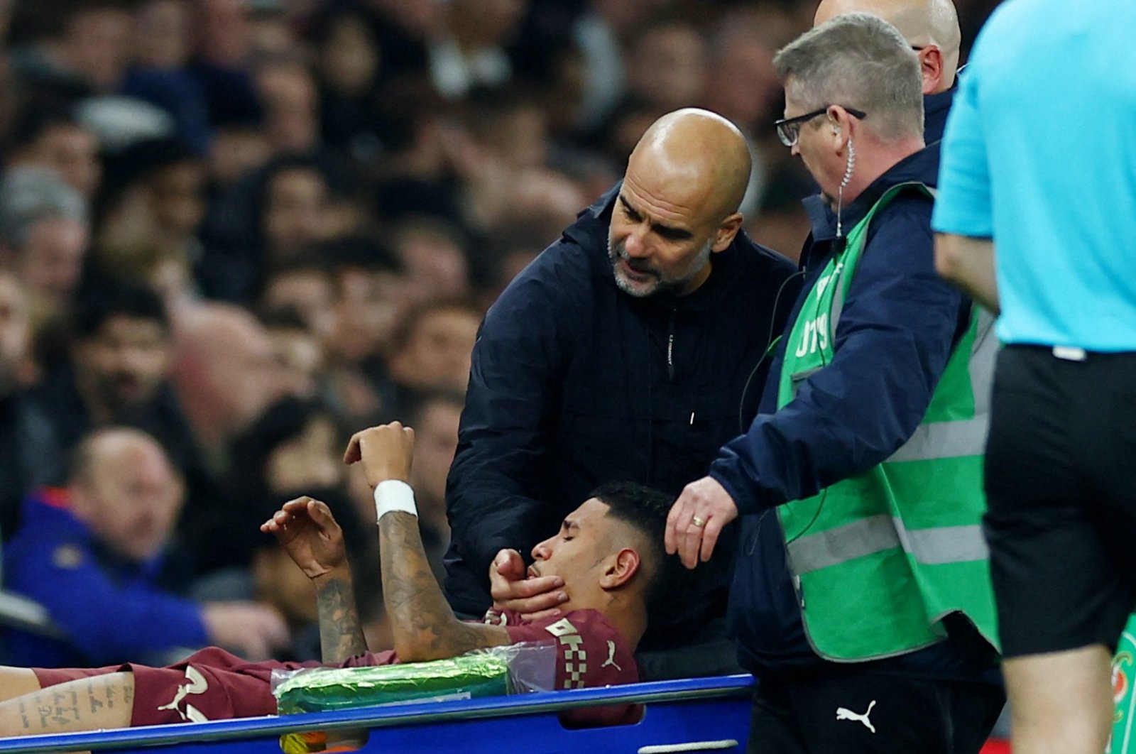 Manchester City&#039;s Savinho is carried away on a stretcher after sustaining an injury as Manchester City manager Pep Guardiola looks on during the Carabao Cup Round of 16 match against Tottenham Hotspur at the Tottenham Hotspur Stadium, London, U.K., Oct. 30, 2024. (Reuters Photo)