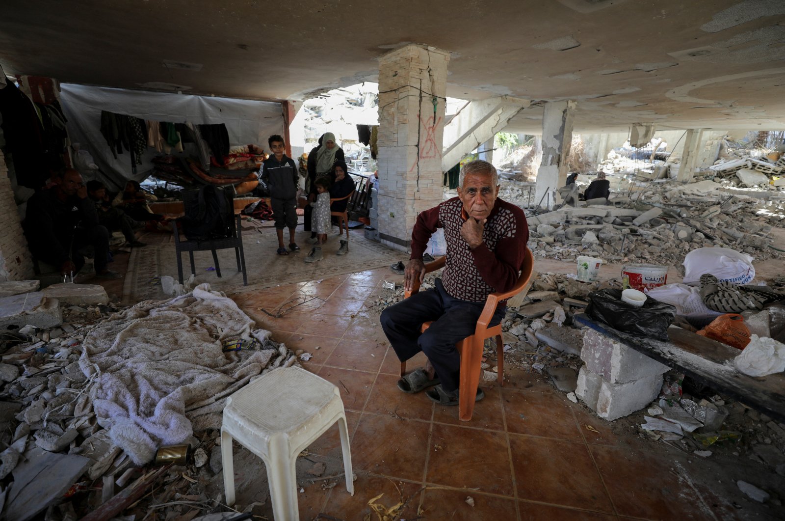 A displaced Palestinian man looks on as he shelters at the ruins of a house in Gaza City, central Gaza, Palestine, Oct. 28, 2024. (Reuters Photo)