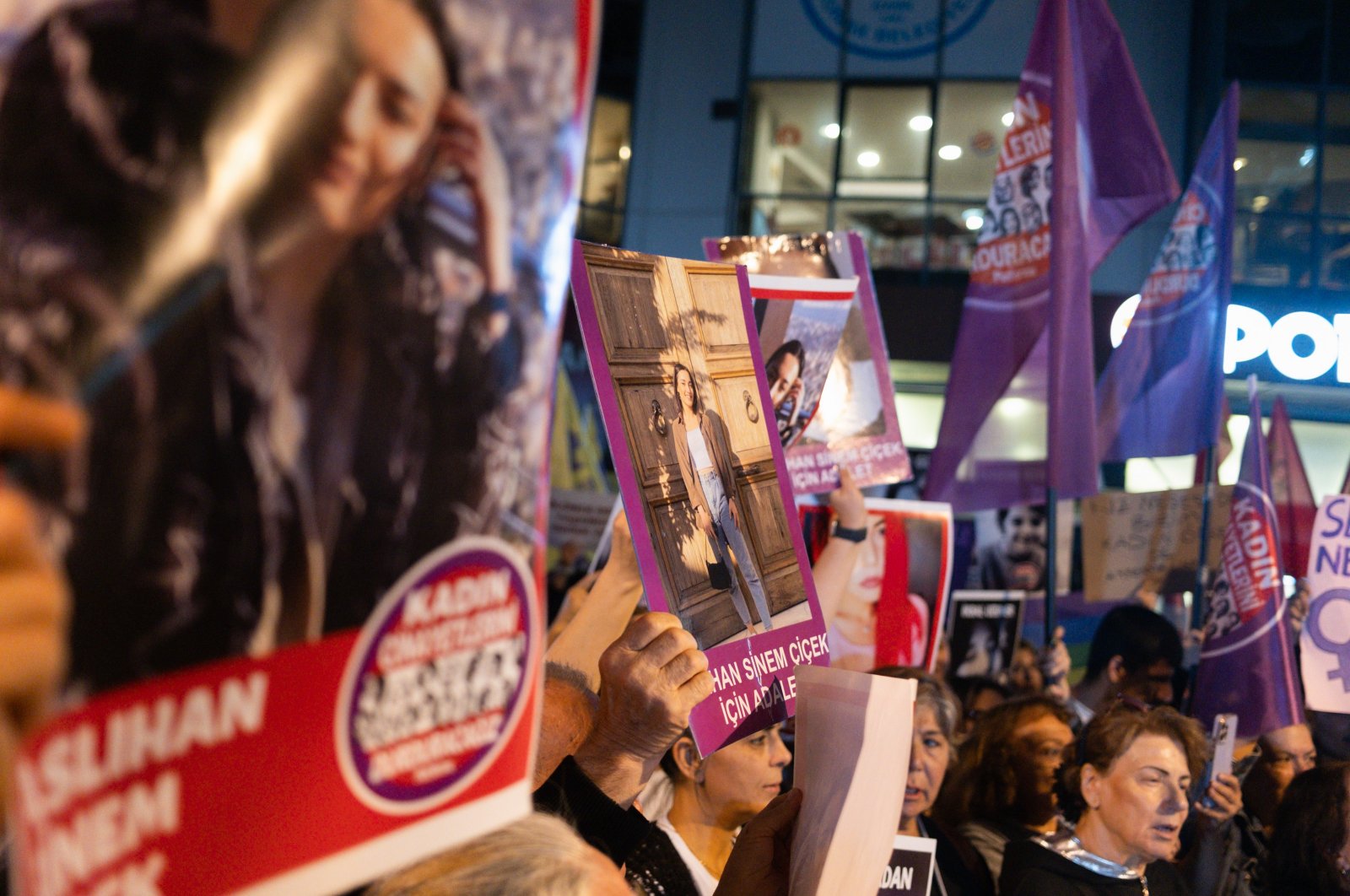 Protesters carry photos of murdered women during a rally against the increasing number of femicides in the country, Izmir, Türkiye, Oct. 16, 2024. (Reuters Photo)