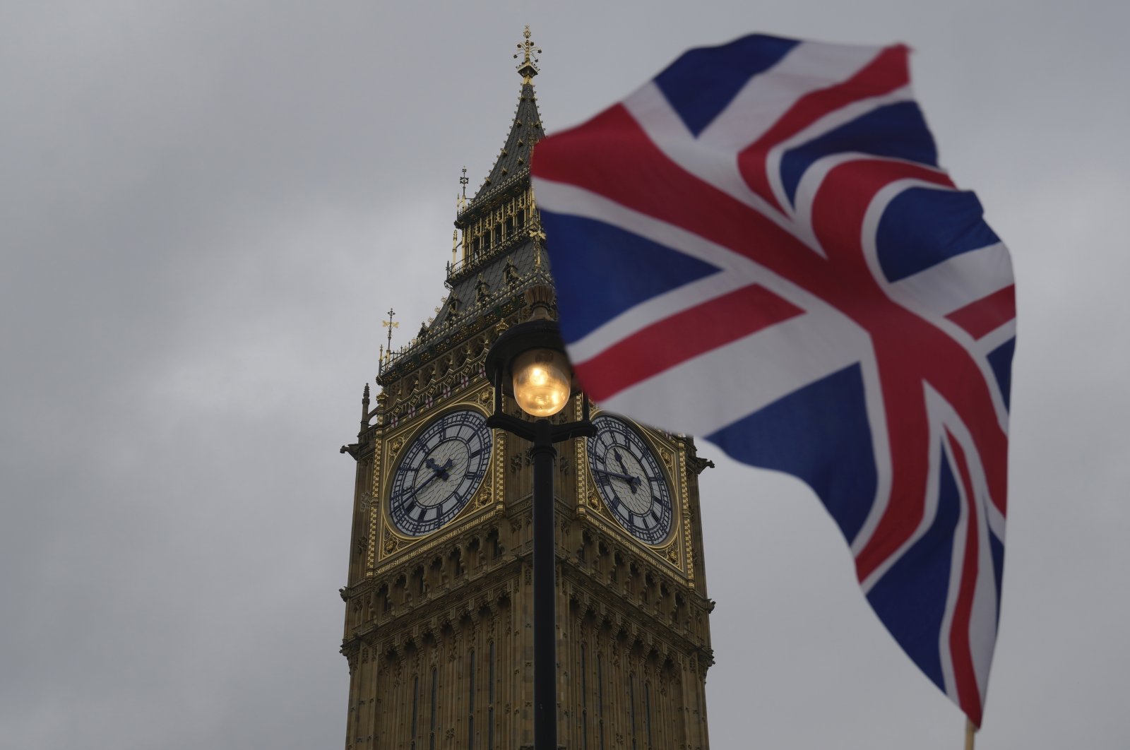 A Union flag is displayed outside the Houses of Parliament, in London, May 23, 2024. (AP Photo)