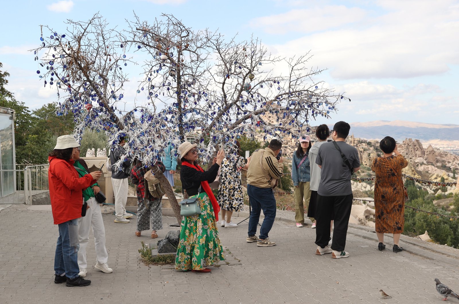 Chinese tourists take photos in the famous Cappadocia region, Nevşehir, central Türkiye, Oct. 1, 2024. (AA Photo)