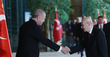 President Recep Tayyip Erdoğan and National Movement Party (MHP) Chairperson Devlet Bahçeli shake hands during a gathering to celebrate Republic Day, Ankara, Türkiye, Oct. 29, 2024. (AA Photo)