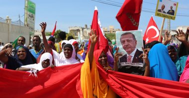 Somali people carry Turkish and Somali flags as they gather in support of Turkish President Tayyip Erdoğan and his government following a coup attempt, Mogadishu, Somalia, July 16, 2016. (Reuters Photo)