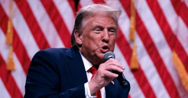 Republican presidential nominee, former President Donald Trump sits down for a conversation with Tucker Carlson during his Live Tour at the Desert Diamond Arena, Phoenix, Arizona, U.S., Oct. 31, 2024. (AFP Photo)