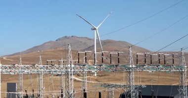 Power grids and a wind turbine are seen in the province of Bayburt, northeastern Türkiye, Oct. 28, 2020. (AA Photo)