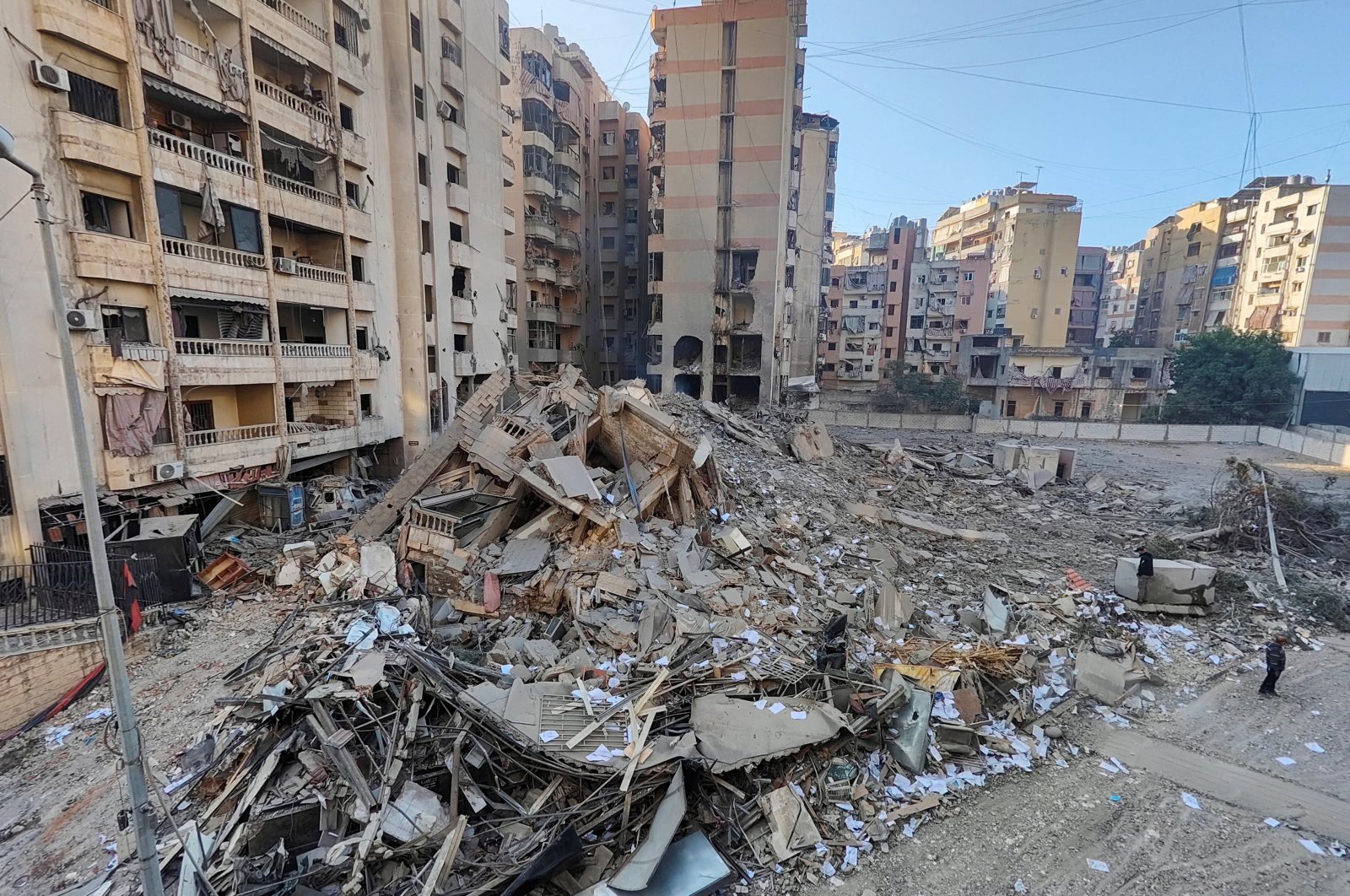 People stand at a site damaged in the aftermath of Israeli strikes, Beirut, Lebanon, Nov. 1, 2024. (Reuters Photo)