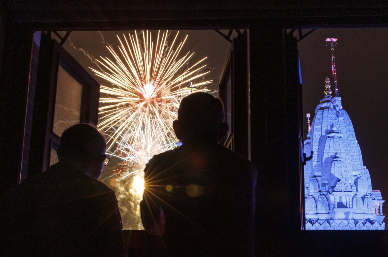 Temple staff watch a fireworks display taking place during Diwali celebrations at Neasden Temple in London, U.K., Oct. 31, 2024. (EPA Photo)