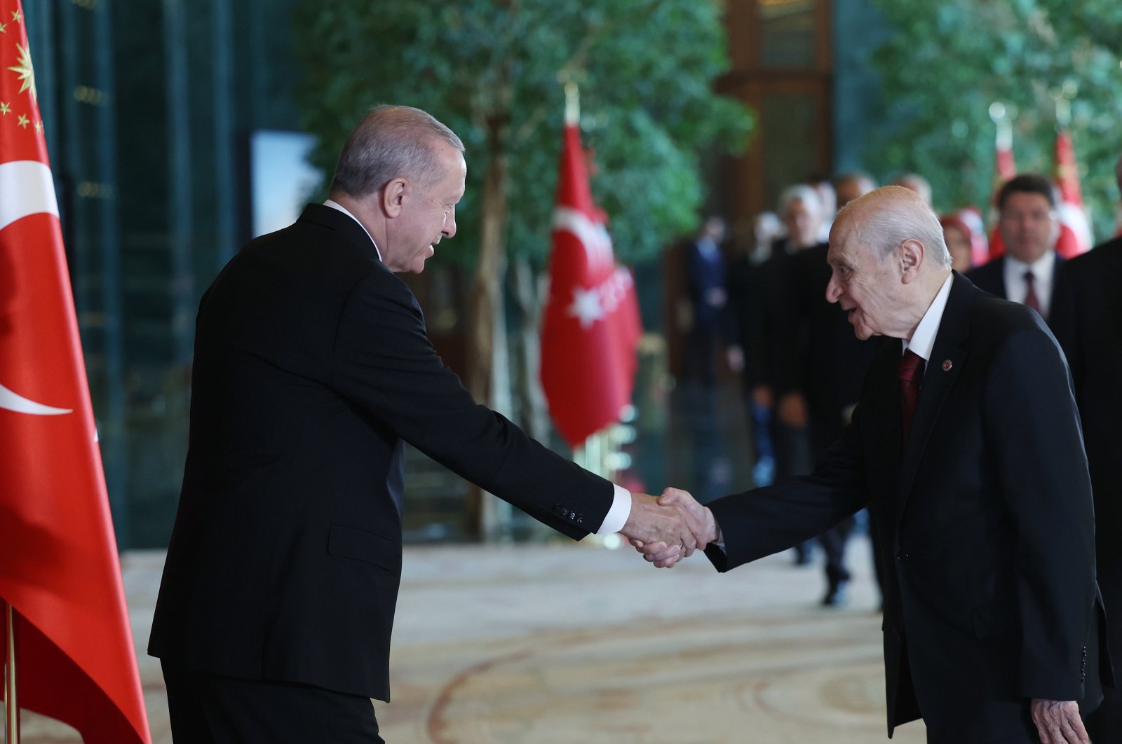 President Recep Tayyip Erdoğan and National Movement Party (MHP) Chairperson Devlet Bahçeli shake hands during a gathering to celebrate Republic Day, Ankara, Türkiye, Oct. 29, 2024. (AA Photo)