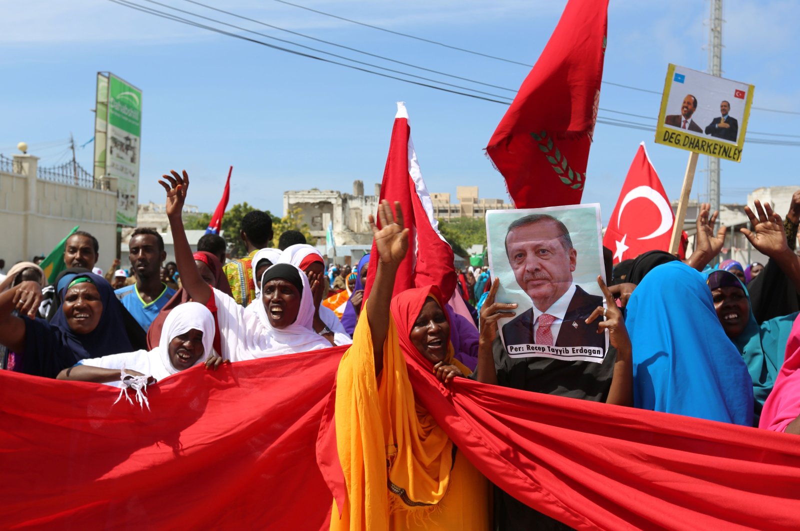 Somali people carry Turkish and Somali flags as they gather in support of Turkish President Tayyip Erdoğan and his government following a coup attempt, Mogadishu, Somalia, July 16, 2016. (Reuters Photo)