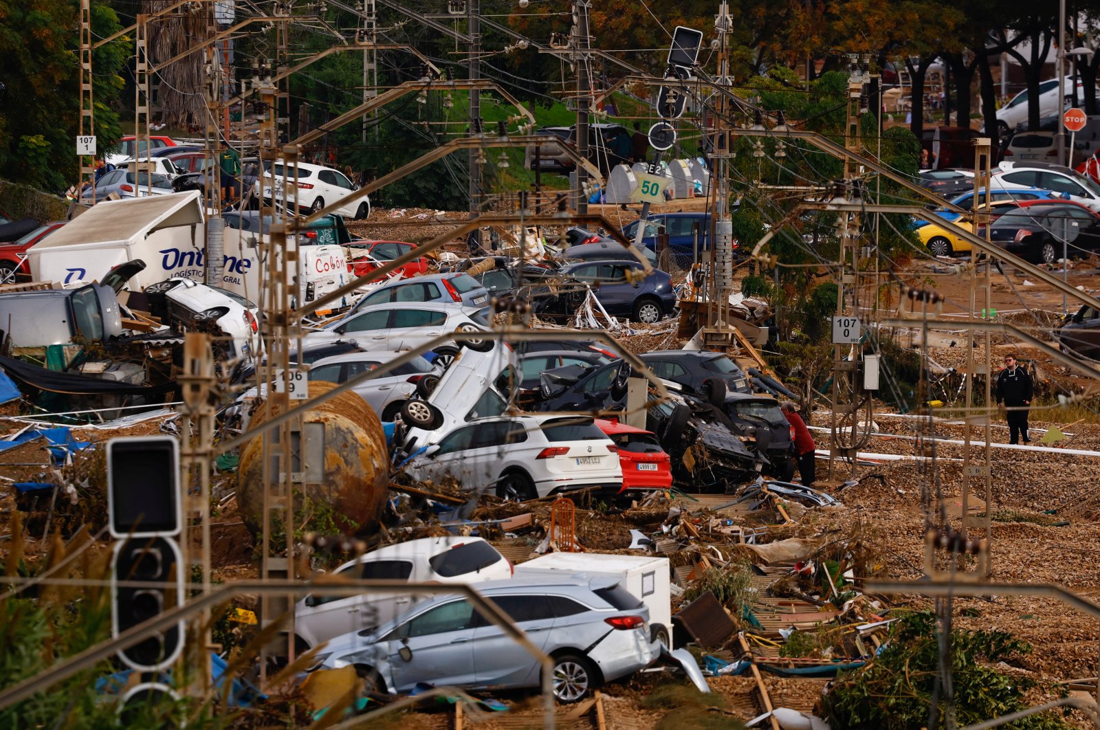 Vehicles are piled up on railroad tracks after heavy rains, Alfafar, Valencia, Spain, Nov. 1, 2024. (Reuters Photo)