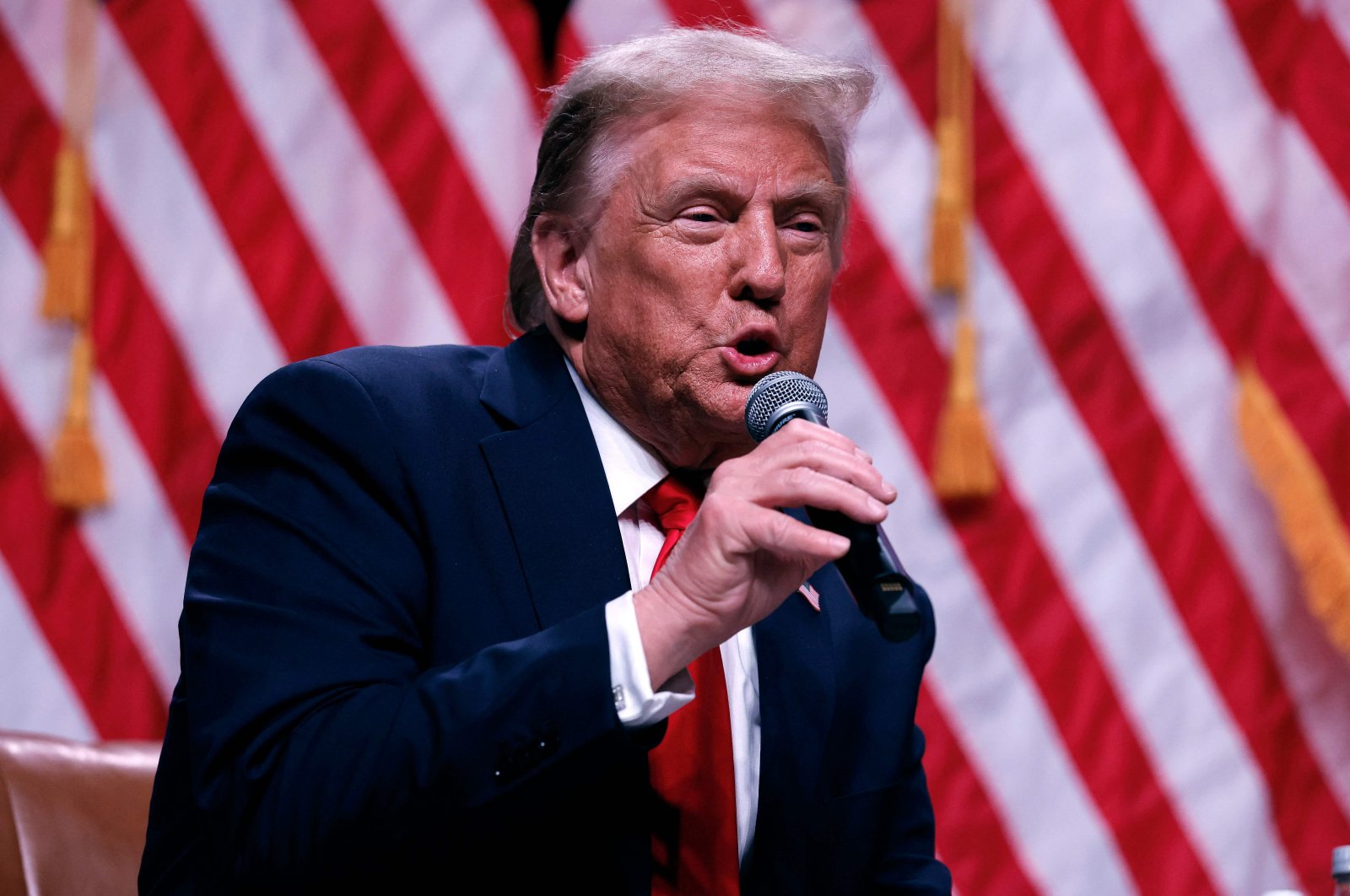 Republican presidential nominee, former President Donald Trump sits down for a conversation with Tucker Carlson during his Live Tour at the Desert Diamond Arena, Phoenix, Arizona, U.S., Oct. 31, 2024. (AFP Photo)