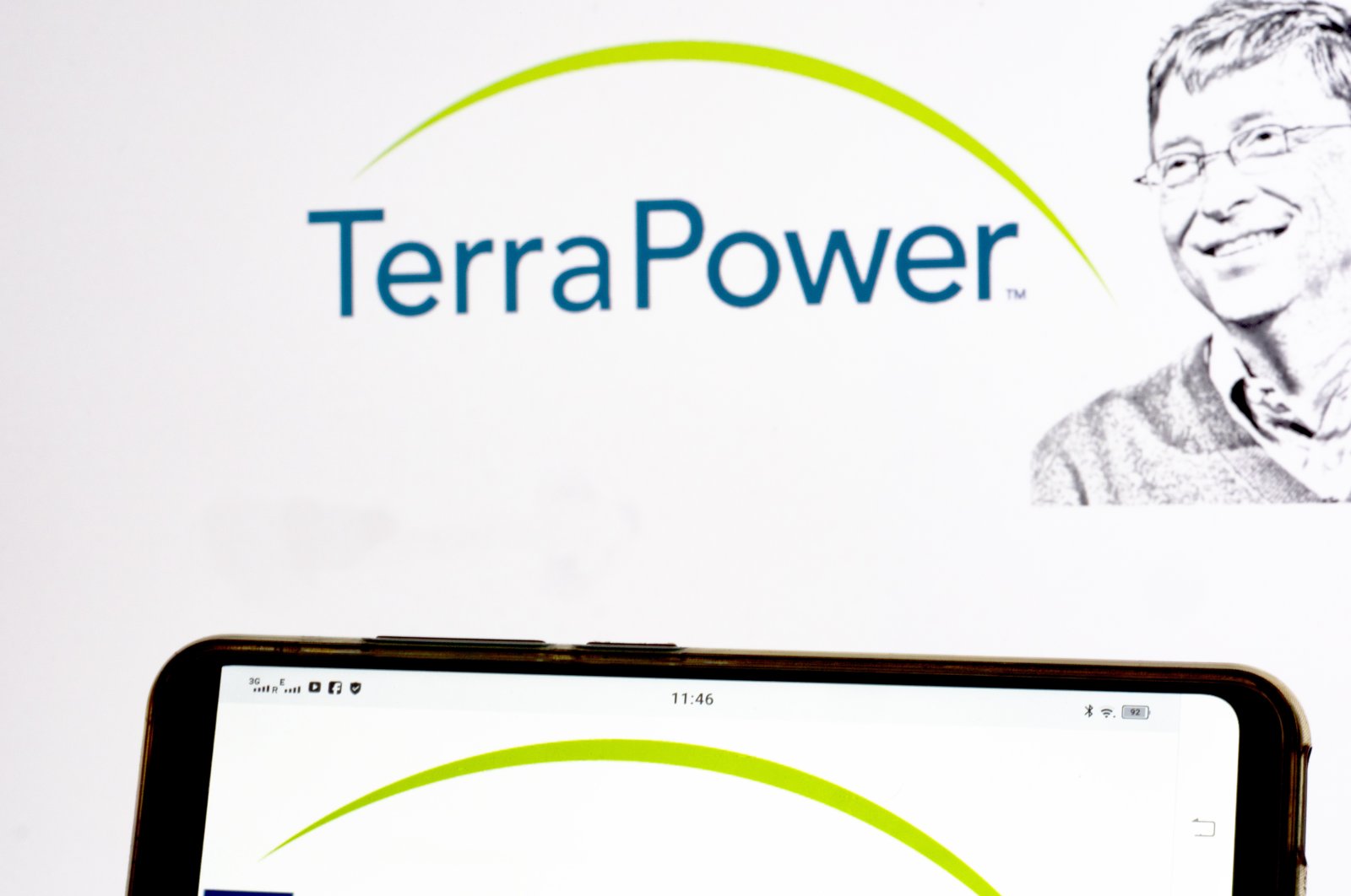 In this photo illustration, the TerraPower logo is seen displayed on a smartphone and in the background, Ukraine, May 25, 2021. (Reuters Photo)