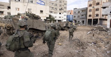 Israeli soldiers walk in the Shijaiyah neighborhood, Gaza Strip, Palestine, Dec. 8, 2023. (AP Photo)
