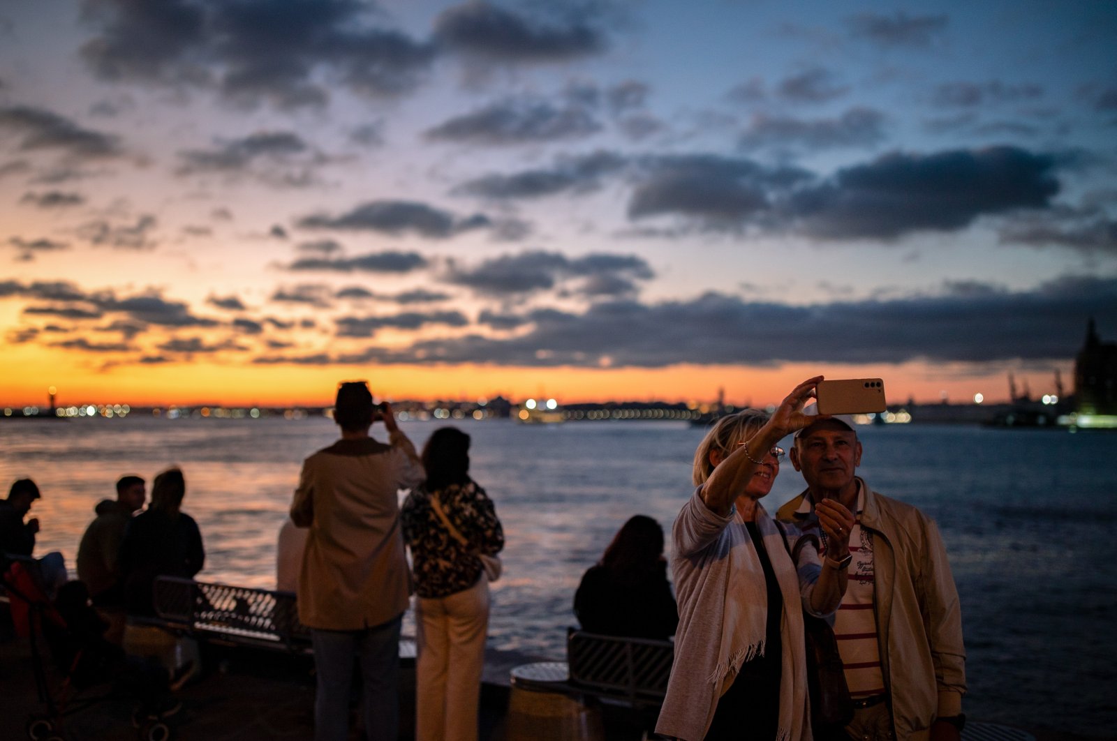 People take photos at sunset, Istanbul, Türkiye, Oct. 15, 2024. (Reuters Photo)