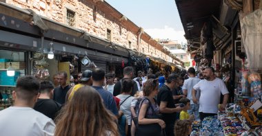 Local shoppers, pedestrians and tourists walk through the old bazaar and market areas of the Eminönü neighborhood of Fatih, Istanbul, Türkiye, June 15, 2024. (Reuters Photo)