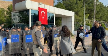 Peoples' Equality and Democracy Party (DEM Party) supporters try to enter the municipality building after a trustee was appointed, Mardin, southeastern Türkiye, Nov. 4, 2024. (İHA Photo)
