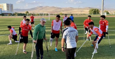 Turkish Special Sports Federation President Alpaslan Erkoç (2nd L) speaks with the amputee football national team, Ankara, Türkiye, Nov. 4, 2024. (AA Photo)