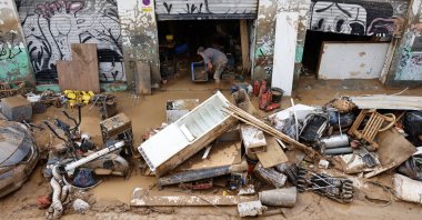 A man clears the debris and mud on his property following last week&#039;s floods in the municipality of Sedavi, province of Valencia, Spain, Nov. 4, 2024. (EPA Photo)