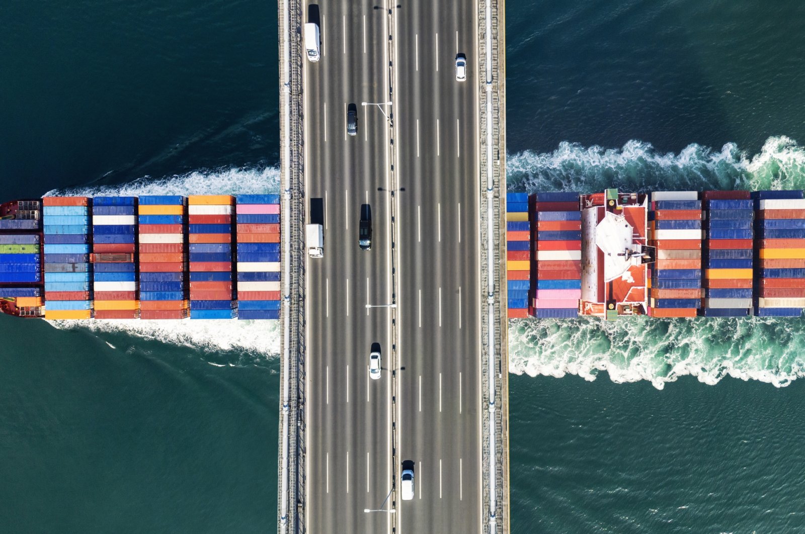 An aerial view of a cargo ship passing beneath a bridge in Istanbul, Türkiye, July 16, 2024. (Getty Images Photo)