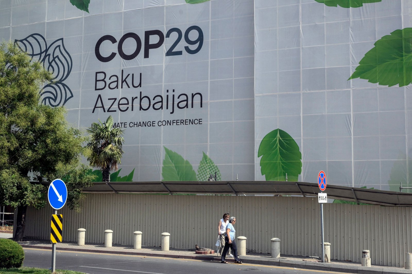 Branding for the COP29 climate conference covers the facade of a building under renovation in Baku, Azerbaijan, Sept. 11, 2024. (AFP Photo)