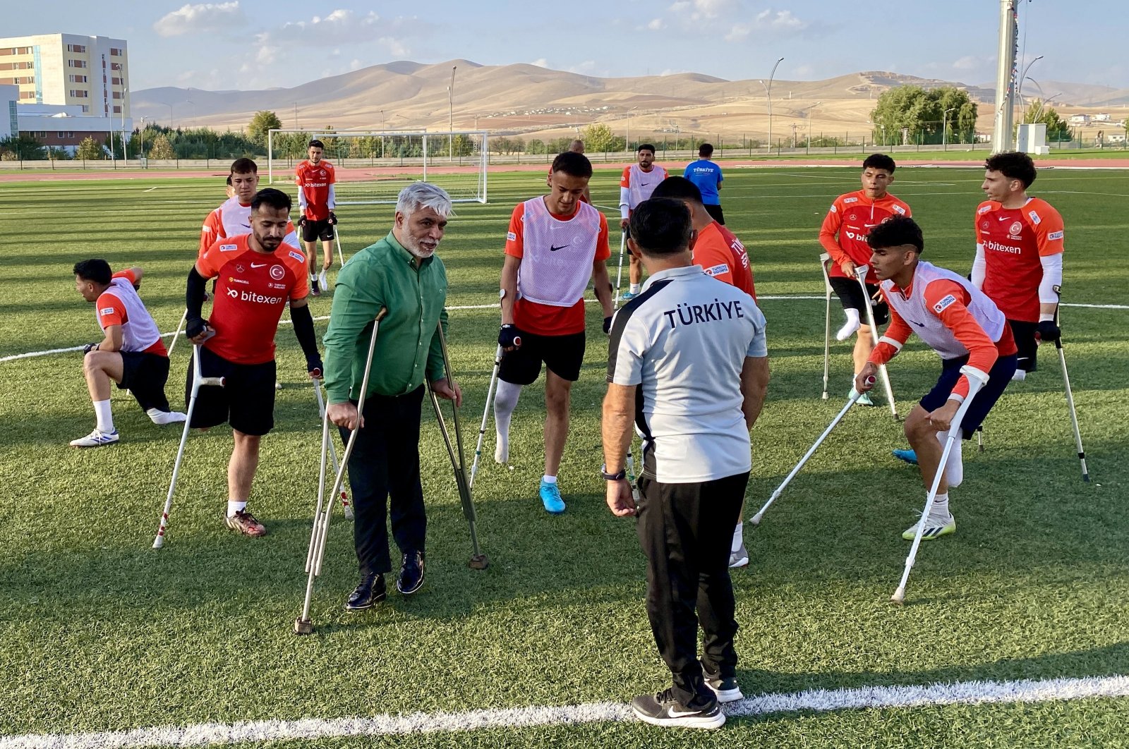 Turkish Special Sports Federation President Alpaslan Erkoç (2nd L) speaks with the amputee football national team, Ankara, Türkiye, Nov. 4, 2024. (AA Photo)