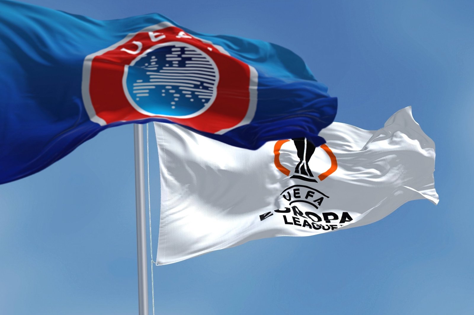 Flags with UEFA and UEFA Europa League flutter in the wind, July 2022. (Shutterstock File Photo)