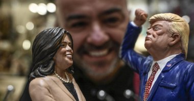 Genny Di Virgilio, a nativity scene artisan from San Gregorio Armeno, looks at his terracotta figurines of U.S. Vice President Kamala Harris and Republican Presidential candidate Donald Trump, in Naples, Italy, Nov. 2, 2024. (EPA Photo)
