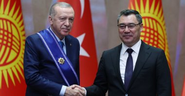 Kyrgyz President Sadyr Japarov (R) shakes hands with President Recep Tayyip Erdoğan after presenting him with a medal of honor at their High-Level Strategic Cooperation Council meeting in the capital of Bishkek, Kyrgyzstan, Nov. 5, 2024. (AA Photo)