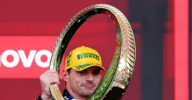 Red Bull's Max Verstappen celebrates with a trophy on the podium after winning the Sao Paulo Grand Prix at the Autodromo Jose Carlos Pace, Sao Paulo, Brazil, Nov. 3, 2024. (Reuters Photo)