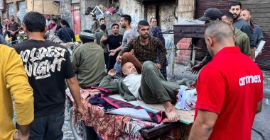 People carry a man injured in Israeli bombardment on Beit Lahia, northern Gaza Strip, Palestine, Nov. 4, 2024. (AFP Photo)
