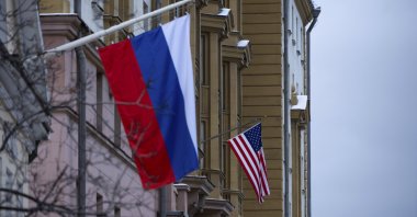 The U.S. Embassy with a U.S. national flag, seen behind a building with a Russian national flag in Moscow, Russia, Tuesday, Nov. 5, 2024. (AP Photo)
