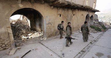 PKK terrorists walk on the streets of Sinjar, Iraq, Jan. 29, 2015. (AP File Photo)