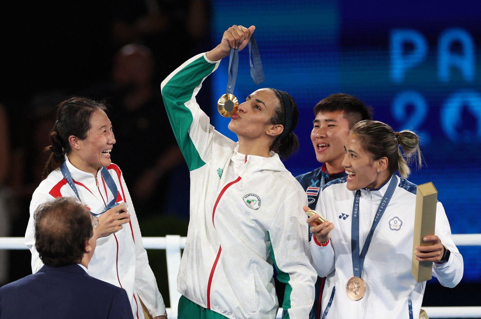 Gold medallist Imane Khelif of Algeria kisses her medal as silver medallist Liu Yang of China, bronze medallists Nien Chin Chen of Taiwan and Janjaem Suwannapheng of Thailand react, Paris, France, Aug. 9, 2024. (Reuters Photo)