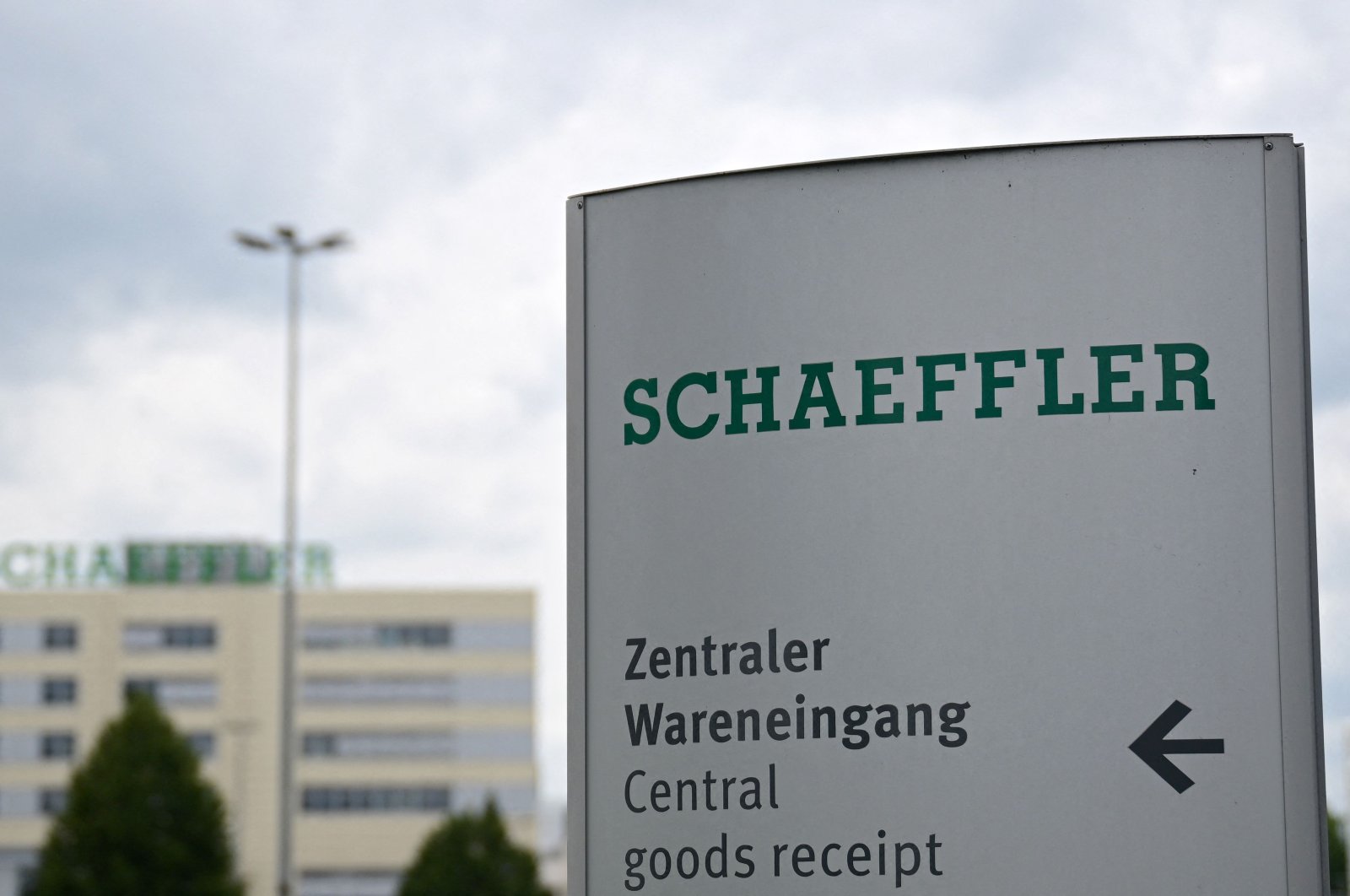 The company&#039;s logo is seen on a sign in front of the headquarters of Schaeffler Group, a German rolling equipment bearings maker for automotive, aerospace and industrial uses, Herzogenaurach, Germany, July 3, 2024. (AFP Photo)