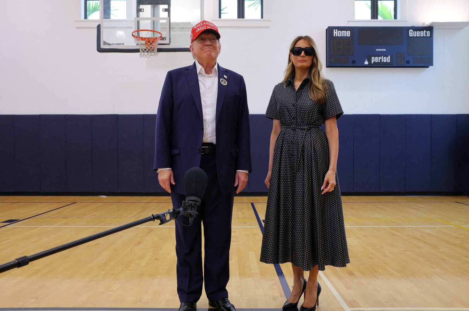 Republican presidential nominee and former U.S. President Donald Trump, accompanied by former U.S. first lady Melania Trump, speaks to reporters as he votes at Mandel Recreation Center on Election Day in Palm Beach, Florida, U.S., Nov. 5, 2024. (Reuters Photo)