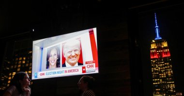People attend a watch party at 230 Fifth Rooftop Bar, as the Empire State Building is seen in the background, New York City, U.S., Nov. 5, 2024. (Reuters Photo)