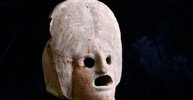 The 2,000-year-old theater mask made of fired clay discovered in Kütahya, Türkiye, Nov. 6, 2024. (AA Photos)