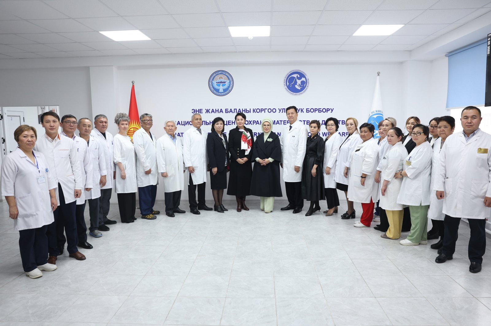 First lady Emine Erdoğan (C-R) and Kyrgyz first lady Aygül Caparova pose with doctors and health care staff during their visit to the National Maternal and Child Protection Center, Bishkek, Kyrgyzstan, Nov. 5, 2024. (AA Photo)