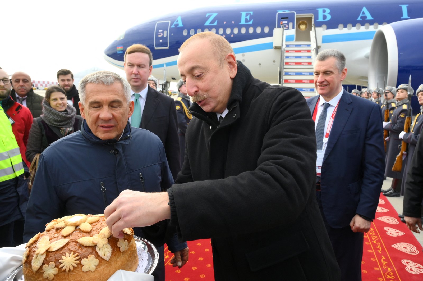 A handout photo of Azerbaijani President Ilham Aliyev (C) attending a welcoming ceremony upon his arrival at Kazan International Airport at the BRICS summit, Kazan, Russia, Oct. 23, 2024. (Reuters Photo)