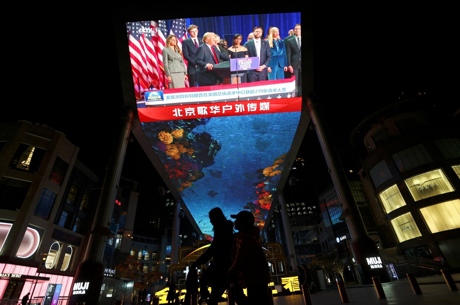 A giant screen displays footage of Republican Donald Trump during a news bulletin on the U.S. election, Beijing, China, Nov. 6, 2024. (Reuters Photo)