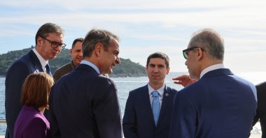 Foreign Minister Hakan Fidan (R) chats with Greek Prime Minister Kyriakos Mitsotakis (2nd R) on the sidelines of an event, Dubrovnik, Croatia, Oct. 9, 2024. (AA Photo)