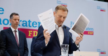Outgoing German Finance Minister and leader of Germany&#039;s Free Democratic Party (FDP) Christian Lindner shows concept papers on growth as he addresses a news conference at his party&#039;s headquarters, Berlin, Germany, Nov. 7, 2024. (AFP Photo)